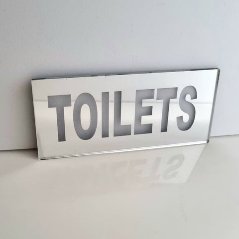 Toilets Mirrored Sign